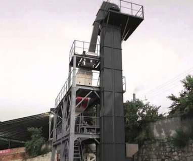 Bucket elevator tower with head drive at a cement plant