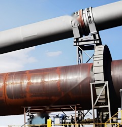 Kiln support roller station and riding ring on a cement rotary kiln