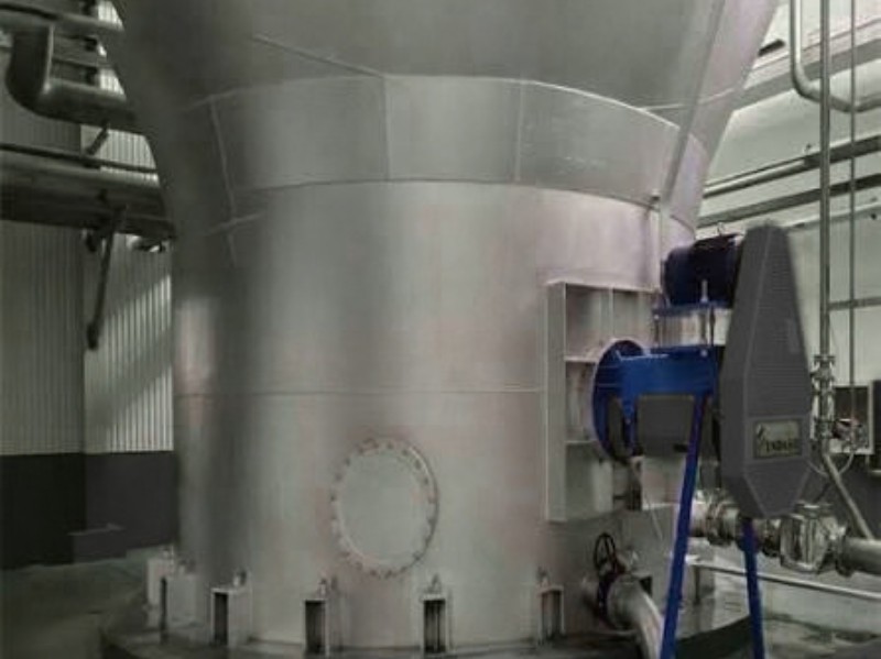 Pulp stock chest with agitator drive motor and gearbox in a paper mill
