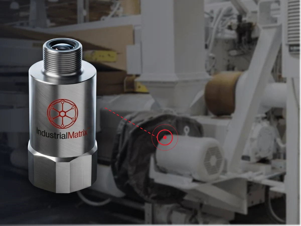 UltraVibe 4-in-1 condition monitoring sensor by Industrial Matrix with its mounting point marked on the drive-end bearing of a corrugator line motor